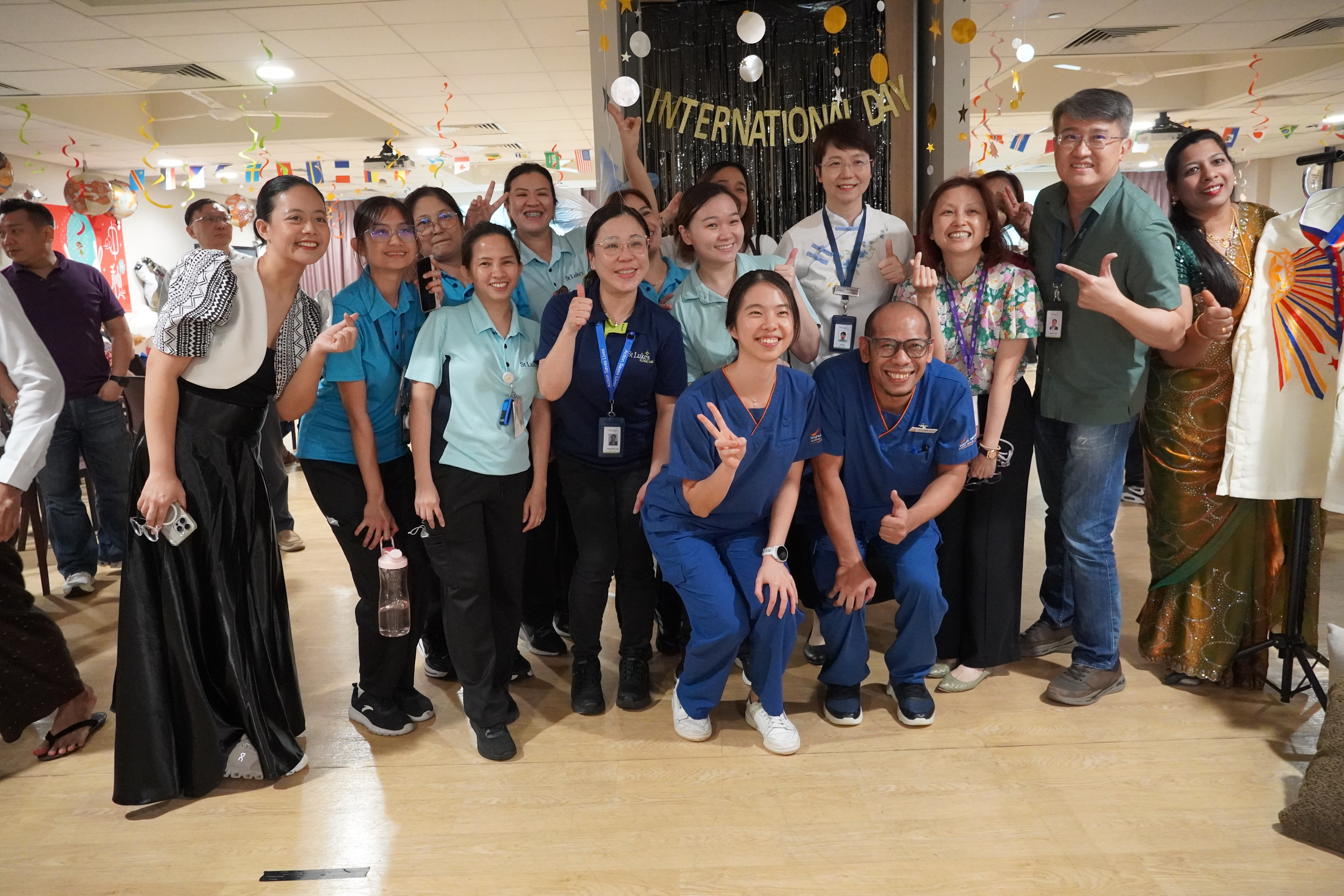 St Luke’s ElderCare team celebrating International Day together